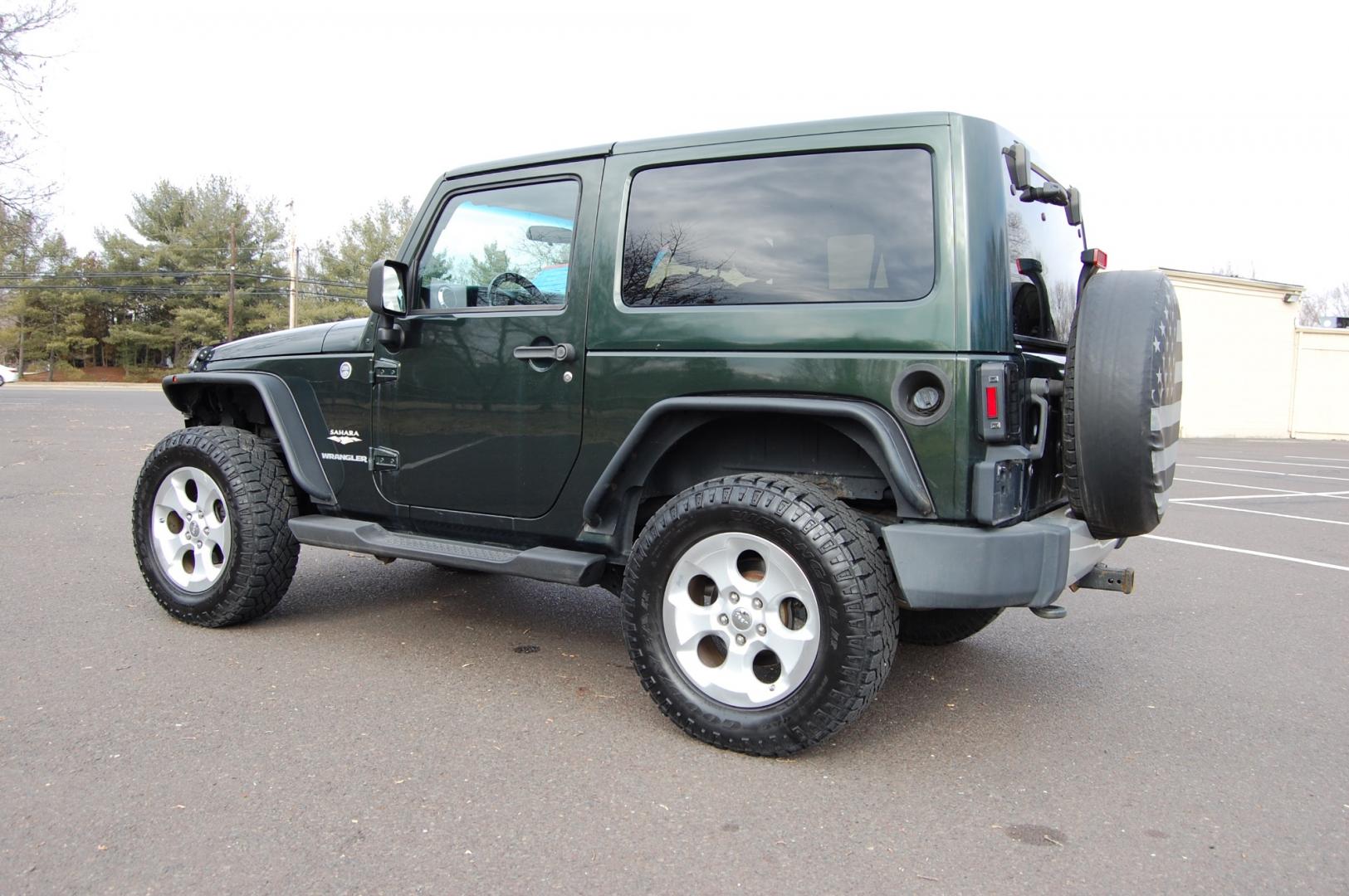 2011 Green /Tan leather Jeep Wrangler Sahara 4WD (1J4AA5D10BL) with an 3.8L V6 OHV 12V engine, 6 Speed Manual transmission, located at 6528 Lower York Road, New Hope, PA, 18938, (215) 862-9555, 40.358707, -74.977882 - Here we have a nice running and driving Jeep Wrangler with a 3.8L V6 putting power to a 4x4 manual transmission. Options include Tan leather, AC, heat, heated front seats, power windows/locks/mirrors, AM/FM/SAT/DISC/AUX radio, cruise control, tilt steering wheel, auto headlights, 3 piece removable h - Photo#4